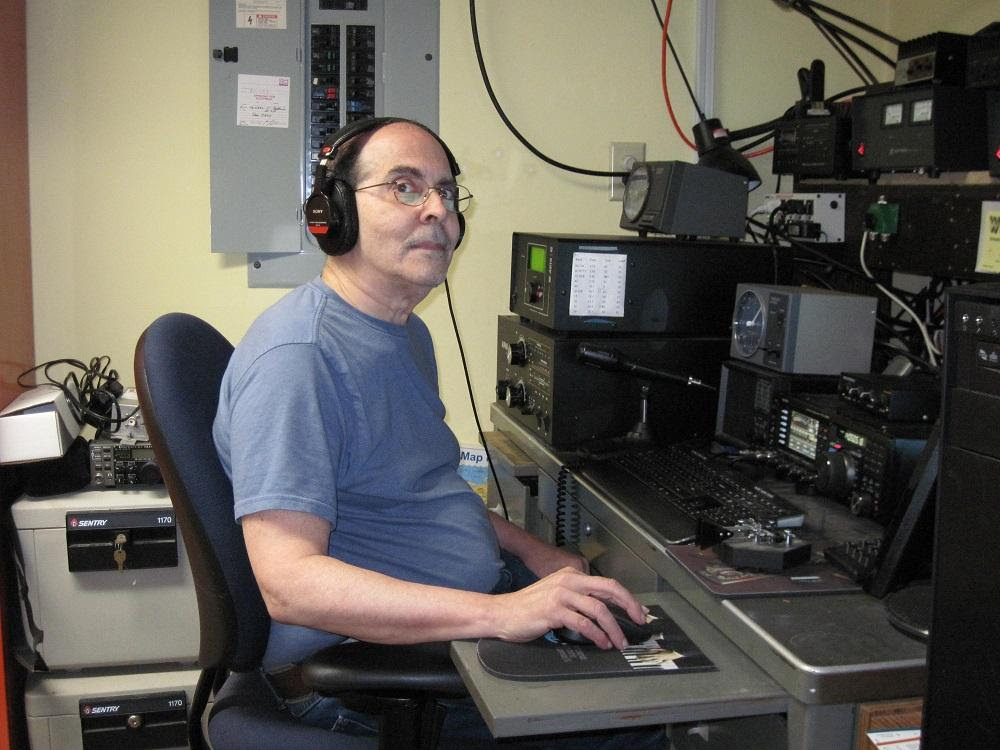 Dr. Mitchell sitting at a radio station